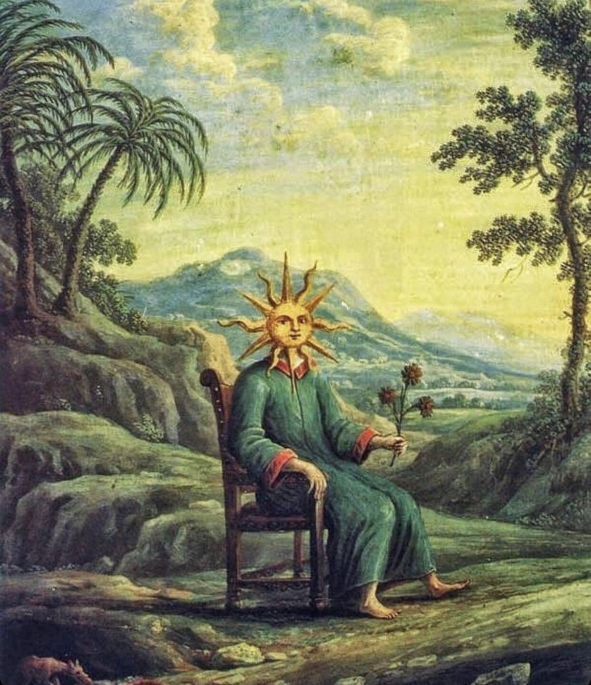 A seated figure with a radiant sun for a head, holding a flower, in a green landscape