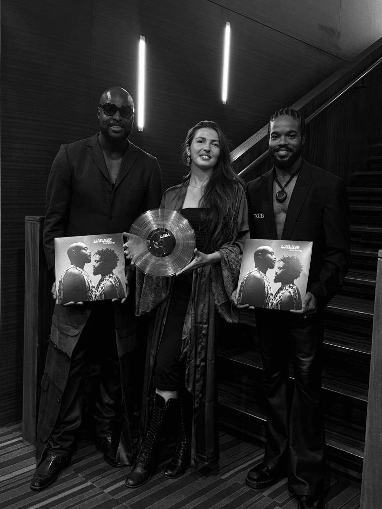 Marieke McKenna with the two members of Illnoledge, holding vinyl copies of their album Everlasting, at the Barbican in London