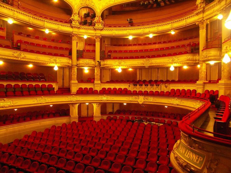 The empty auditorium of ITA in Amsterdam: red velvet seats and gilded balconies