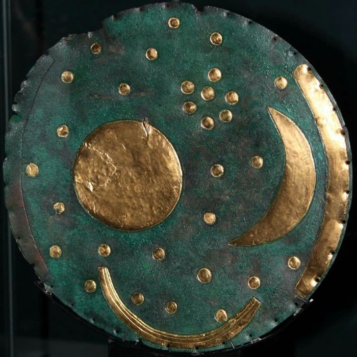 The Nebra sky disc: a bronze disc with a gold sun or full moon, a crescent moon and a cluster of stars